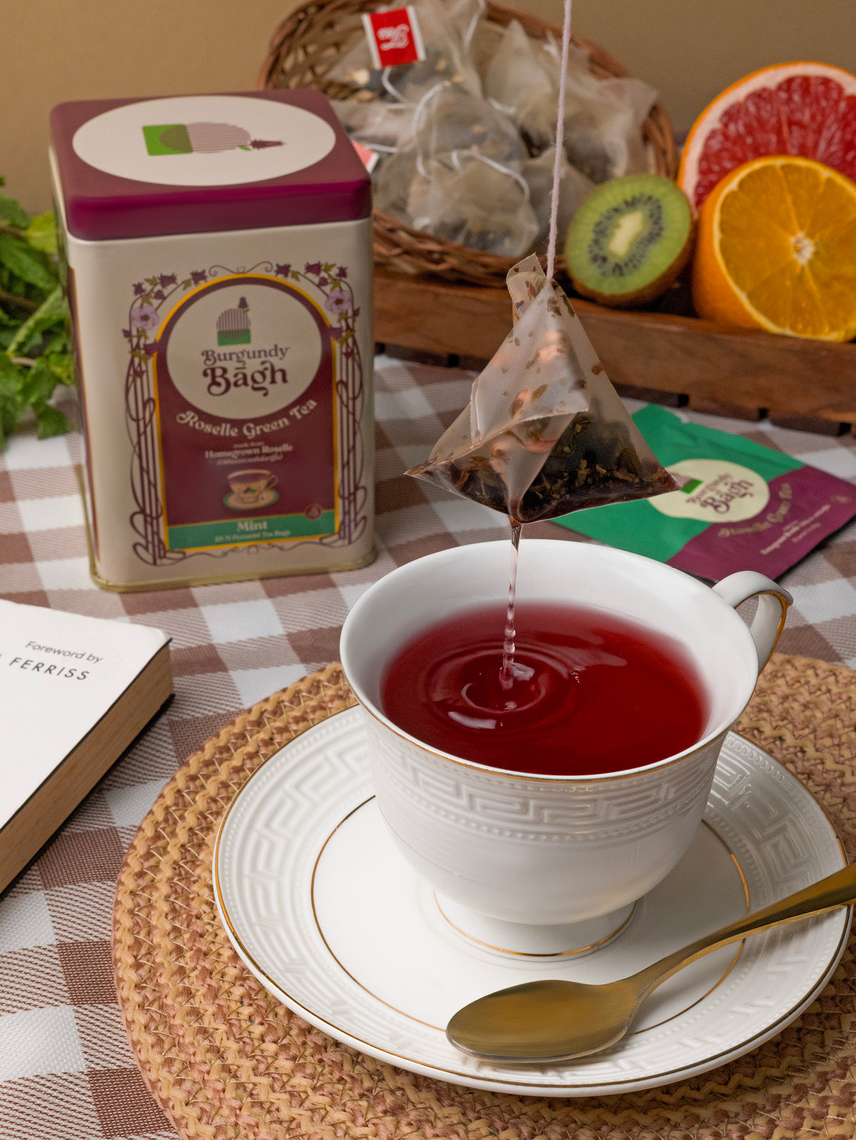 Burgundy Bagh Roselle Green Tea brewing into a white porcelain cup