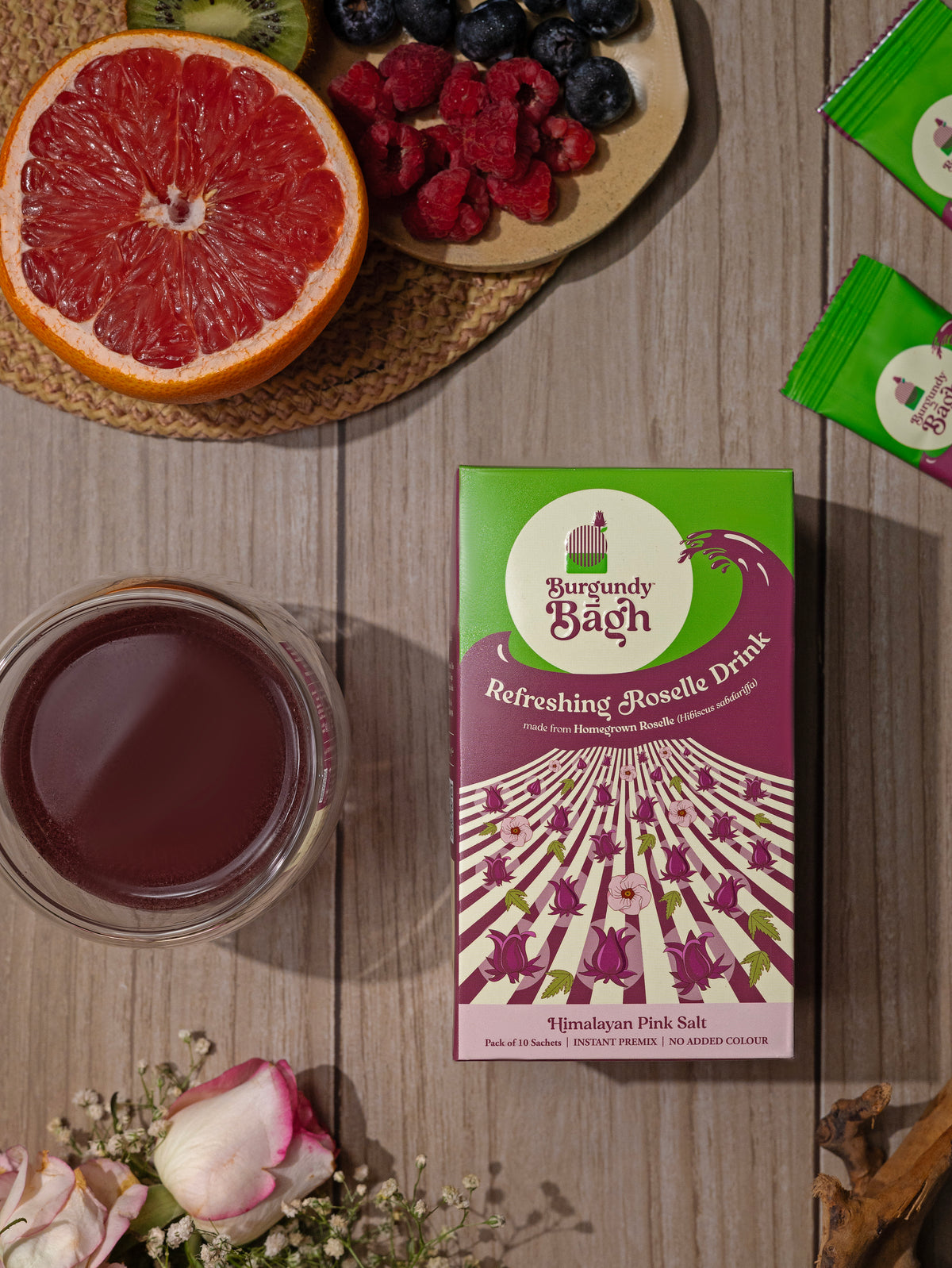 Burgundy Bagh Refreshing Roselle Drink pre-mix with grapefruit and a glass of chilled roselle