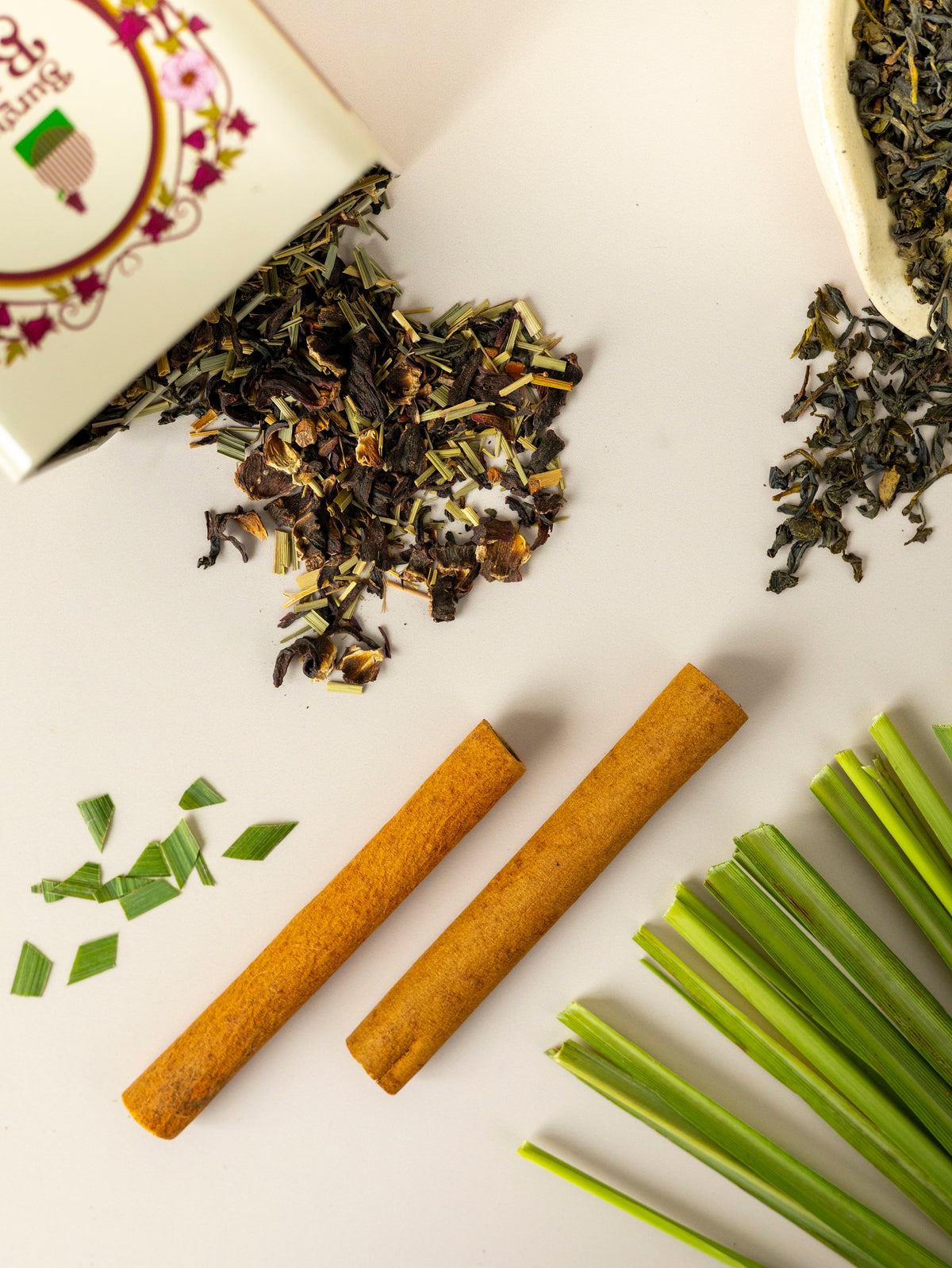 Cinnamon bark and lemongrass alongside roselle green tea leaves