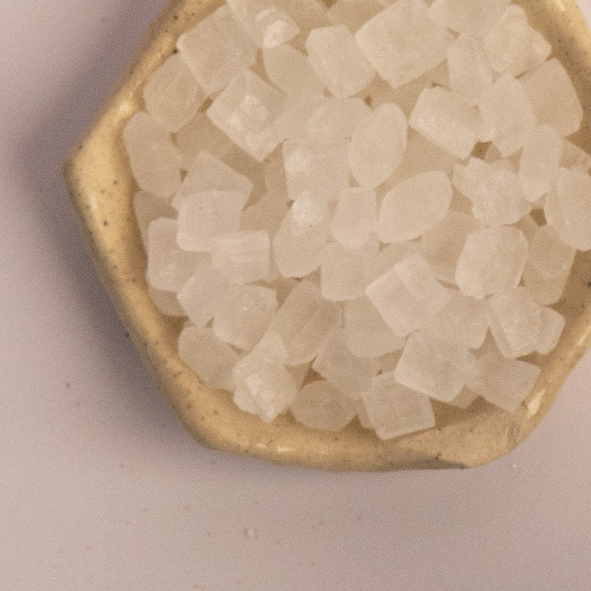 Rock sugar crystals, or mishri, in a stone dish